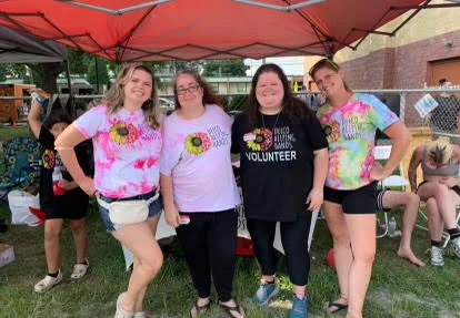 Team members of Delco Helping Hands posing at a community event