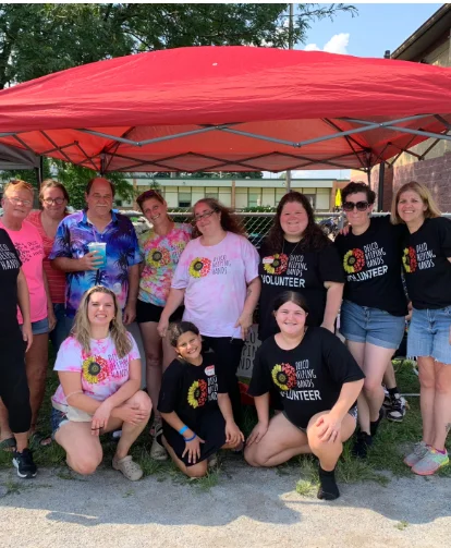 Delco Helping Hands volunteers gathered at an outdoor event